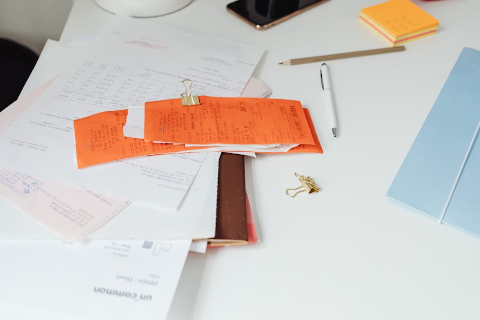 Receipt on desk with phone ready to scan